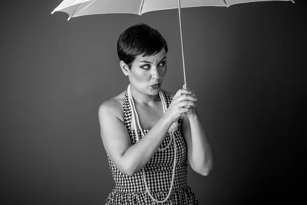 girl holding  white umbrella
