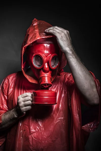 Man with red gas mask