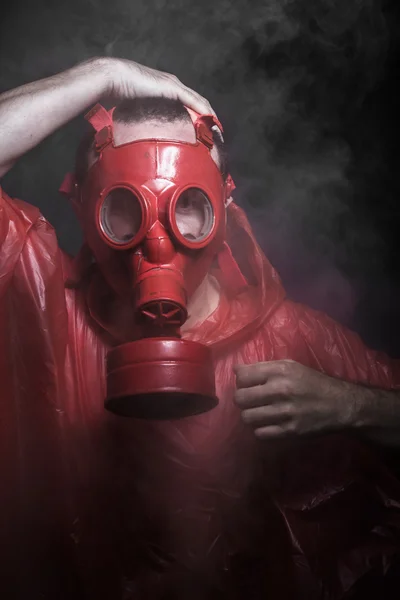 Man with red gas mask