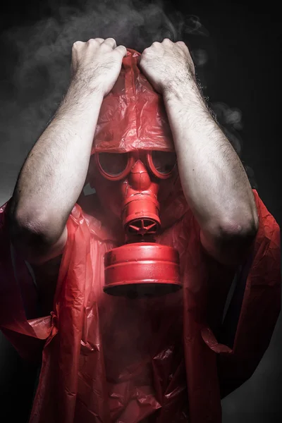 Man with red gas mask