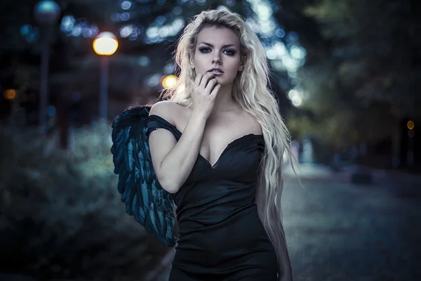 Fallen angel with black wings