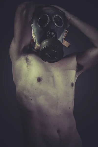 Nude man with gas mask