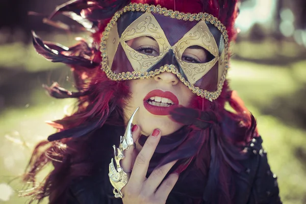 Woman in colorful venetian mask
