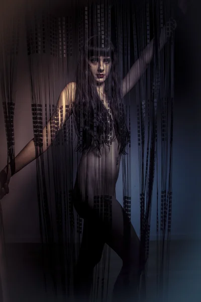 Naked girl behind curtains