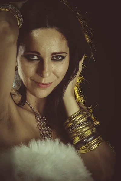 Woman wearing fur and jewelry