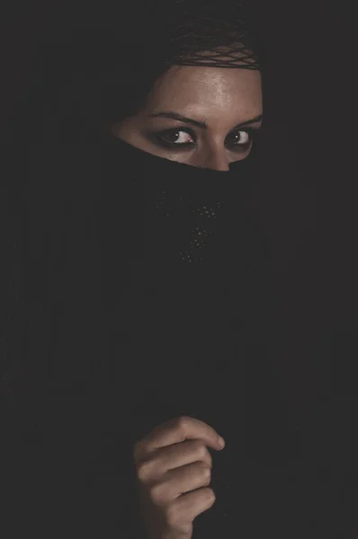 Woman in  brown veil posing