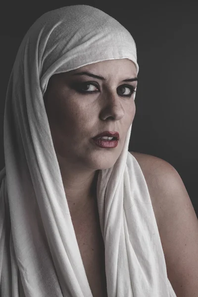 woman with a white towel on her head