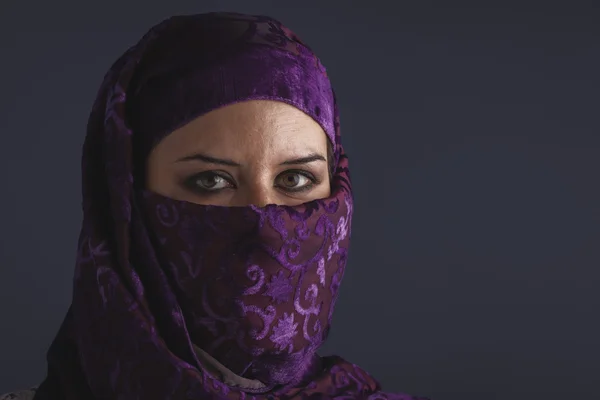 Woman with traditional burqa veil