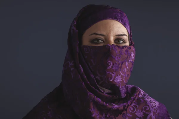 Woman with traditional burqa veil
