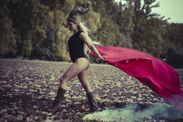 Woman posing  with red cape