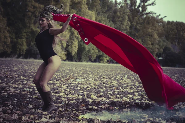 Woman posing  with red cape