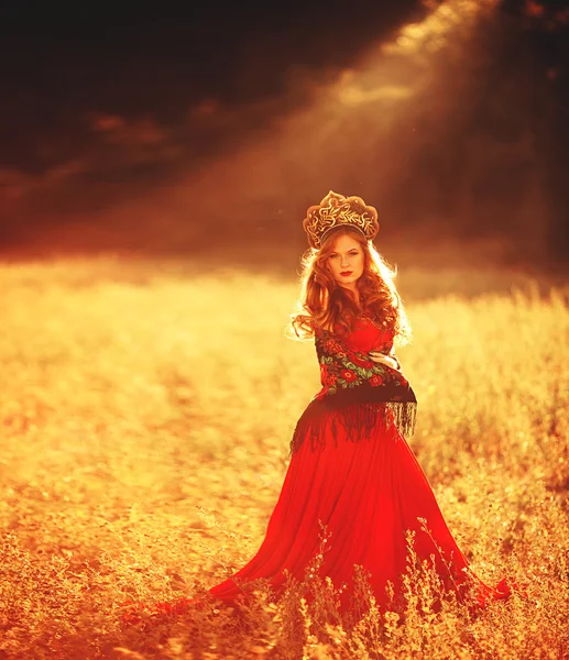 Girl in red dress and russian traditional headdress