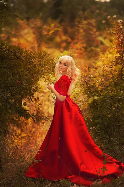 Beautiful gorgeous Woman model in elegant mermaid red dress