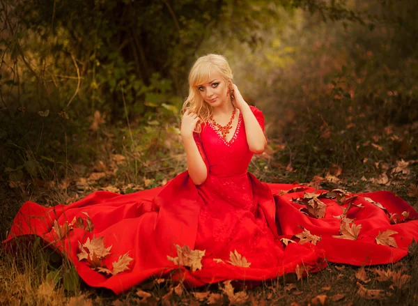 Beautiful gorgeous Woman model in elegant mermaid red dress