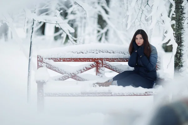 Young girl sitting on bench