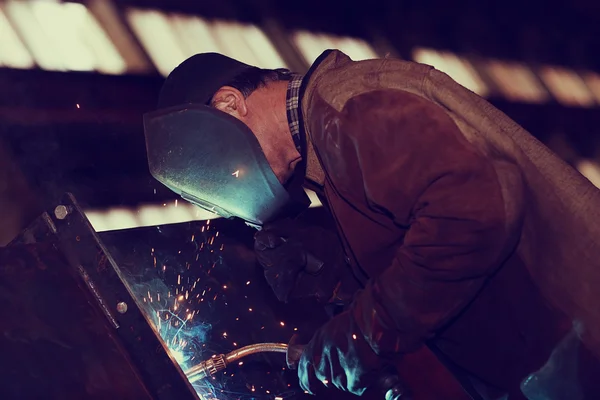 Welder working at the factory