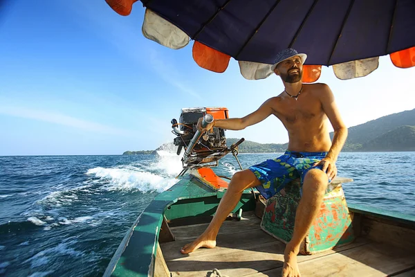 Tanned man on boat