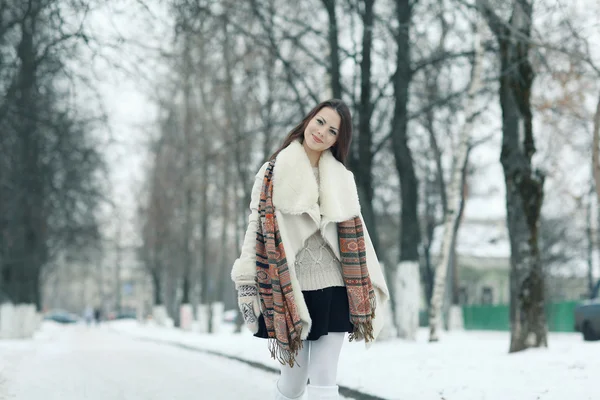 Beautiful young girl in winter