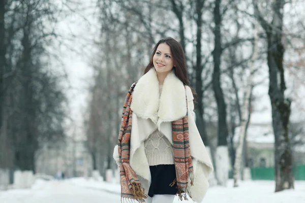 Beautiful young girl in winter