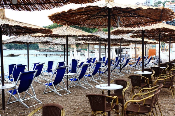 Beach umbrellas and lounge chairs