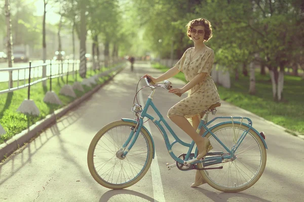 Young girl  riding retro  bicycle