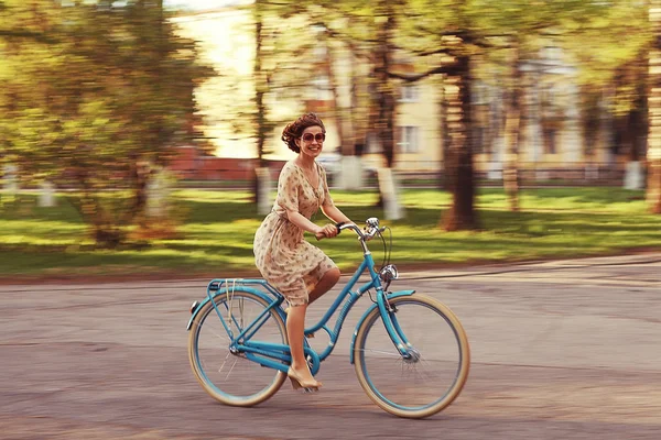 Girl on a bicycle at spring morning