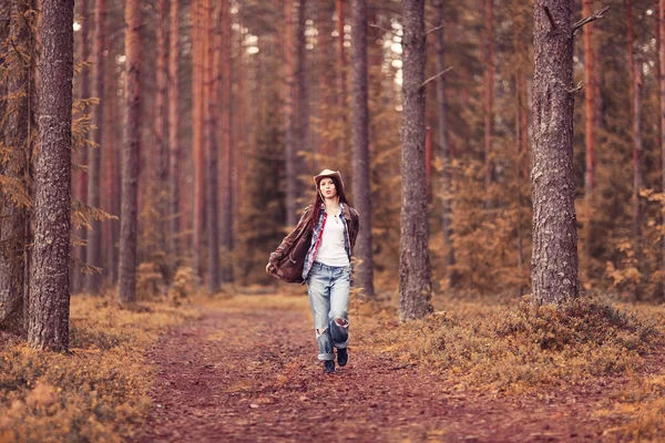 Young girl in the forest ranger