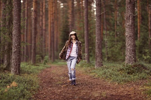 Young girl in the forest ranger