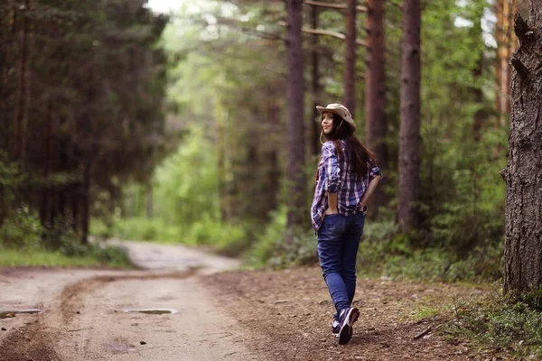 Young girl in the forest ranger