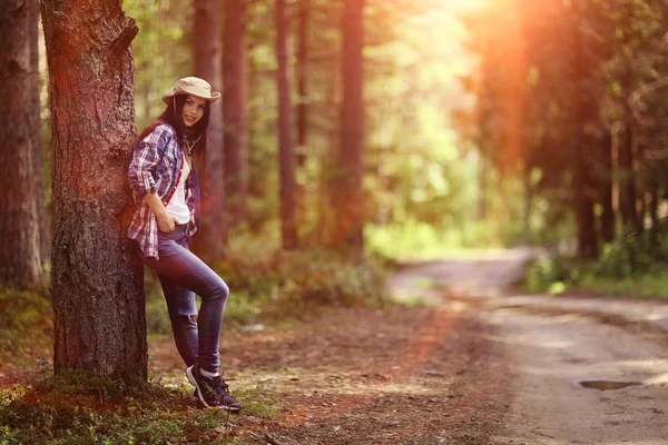 Young girl in the forest ranger