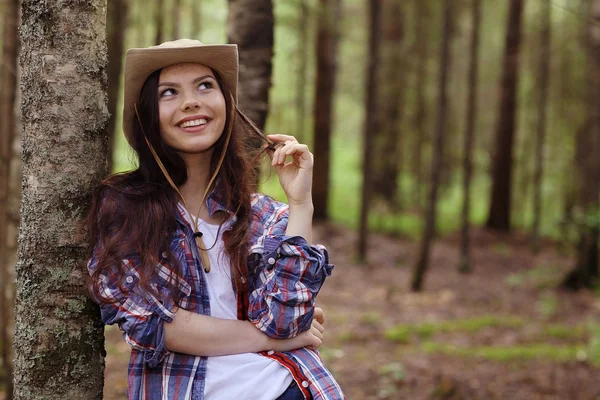 Young girl in the forest ranger