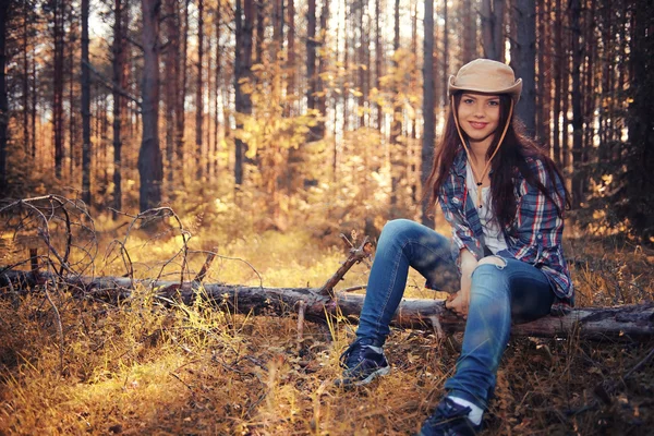 Young girl in the forest ranger