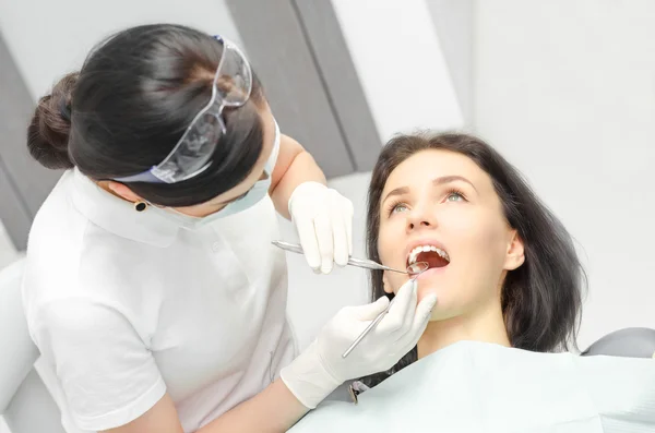 Young woman checked on the dentist\'s chair