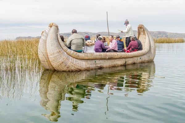Visitors on a reed boat near Uros floating islands