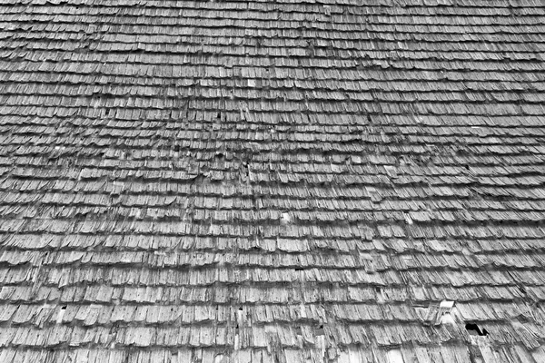 Damaged traditional shingle roof