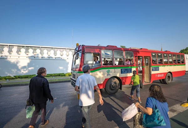 Bangkok, Thailand - April 8: People getting on the bus opposite