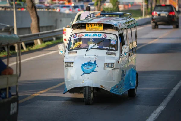 AYUTTHAYA, THAILAND - 6 DEC 2015: Tuk-Tuk driving on the road. I