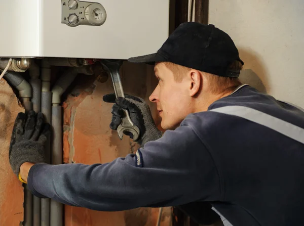 Man connects the gas boiler