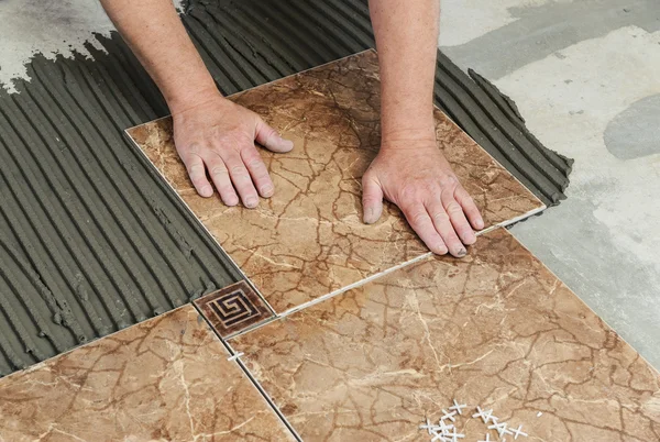 Laying the tiles