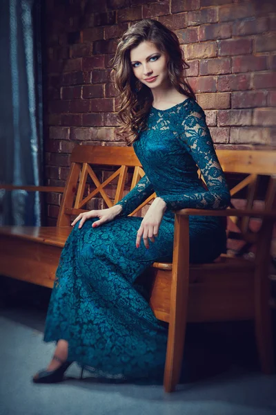 Fashion woman in dress of a green lace