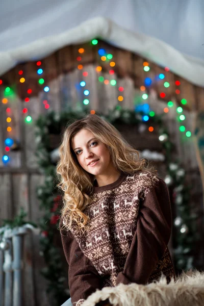 Girl with Christmas around porch