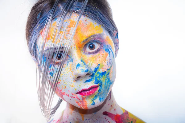 Woman with painted face, body art