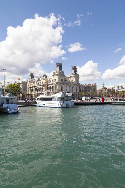 View  from the sea on Port Vell and Barcelona\'s old Customs building, Barcelona, Spain