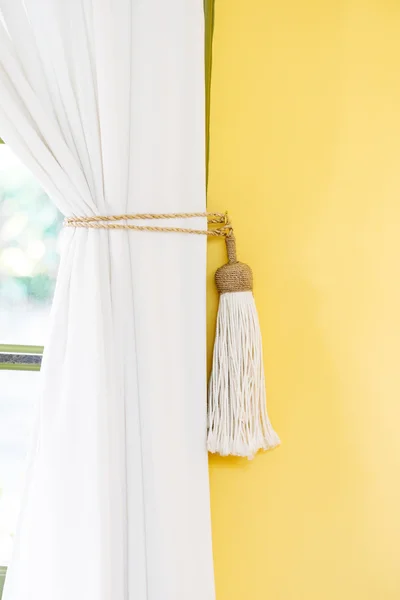 White curtain tie-back home decor simple style indoors yellow wall