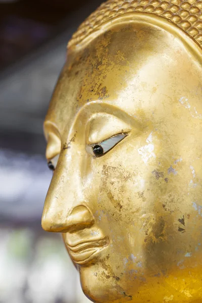 Golden Buddha half face you can feel peace