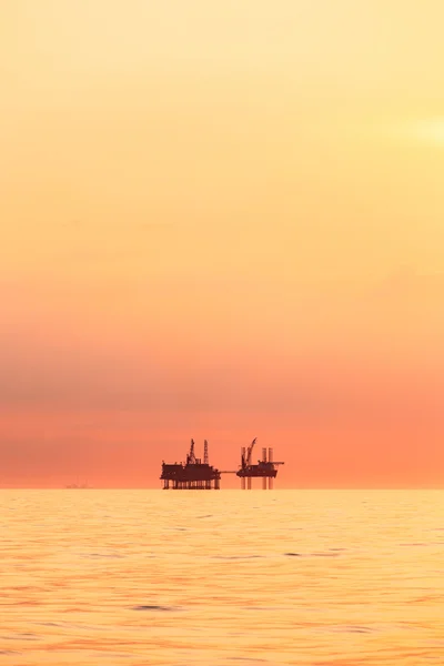 Silhouette of oil the platform