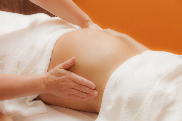 Pregnant woman receiving prenatal massage
