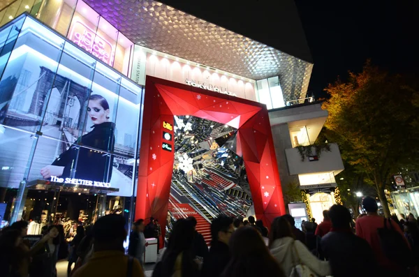 Tokyo, Japan - November 24, 2013: People shopping around Retail shops on Omotesando Street