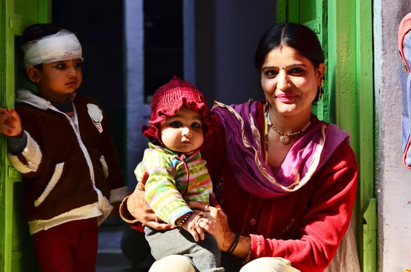Jodhpur, India - January 1, 2015: Indian proud mother poses with her children in Jodhpur, India.