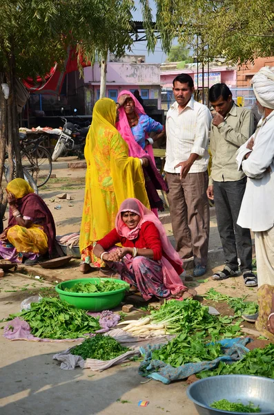 Jodhpur, India - January 2, 2015: Indian people shopping at  typical vegetable street market in India